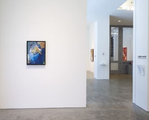 Installation View © Roz Akin, Courtesy Berry Campbell, New York A view of a gallery showing white walls and a view into other gallery spaces in the distance, one painting, and a hardwood floor.